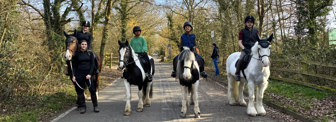 Four riders in Grange Farm Lane